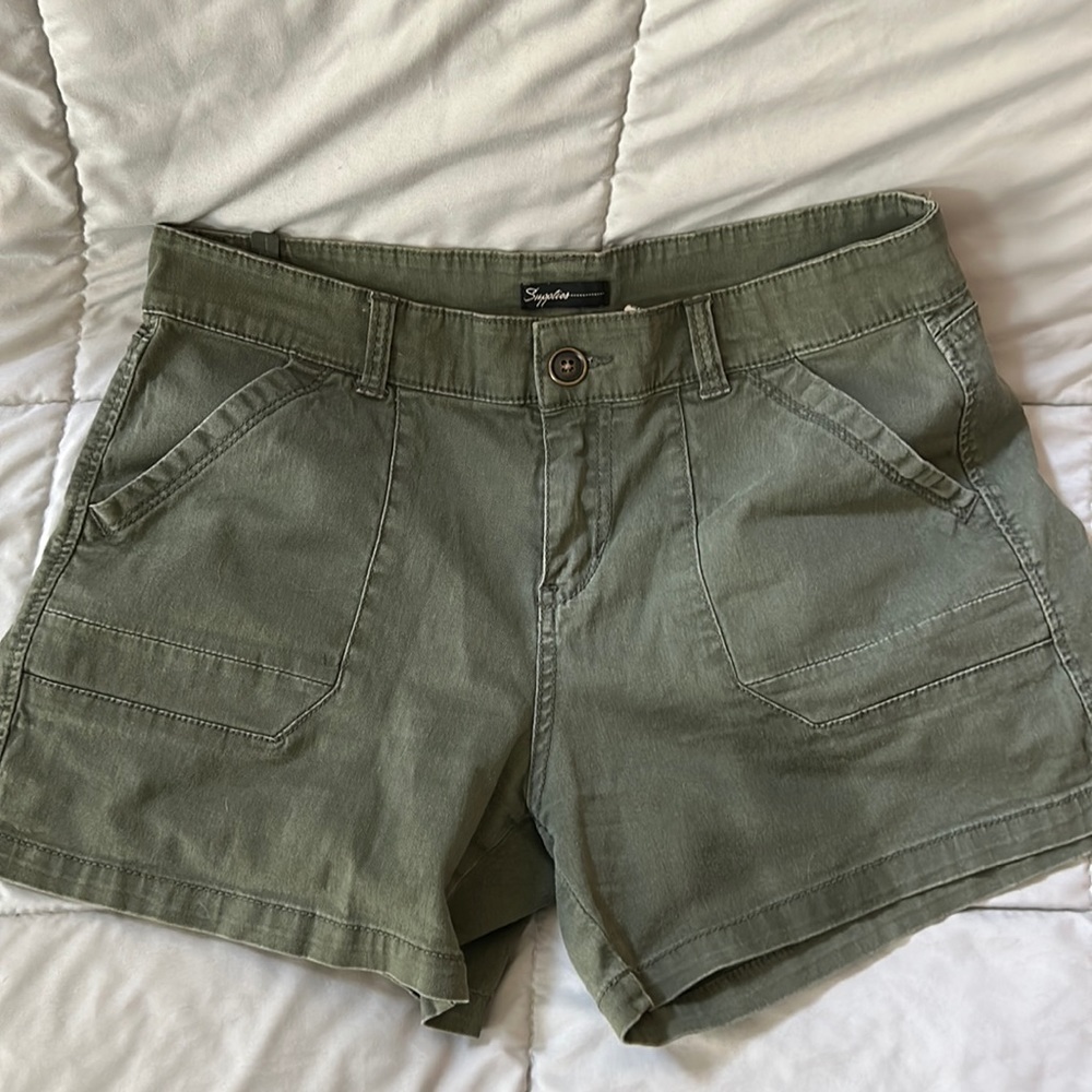 Size 12 shorts. Olive colored.  Zipper closure with pockets